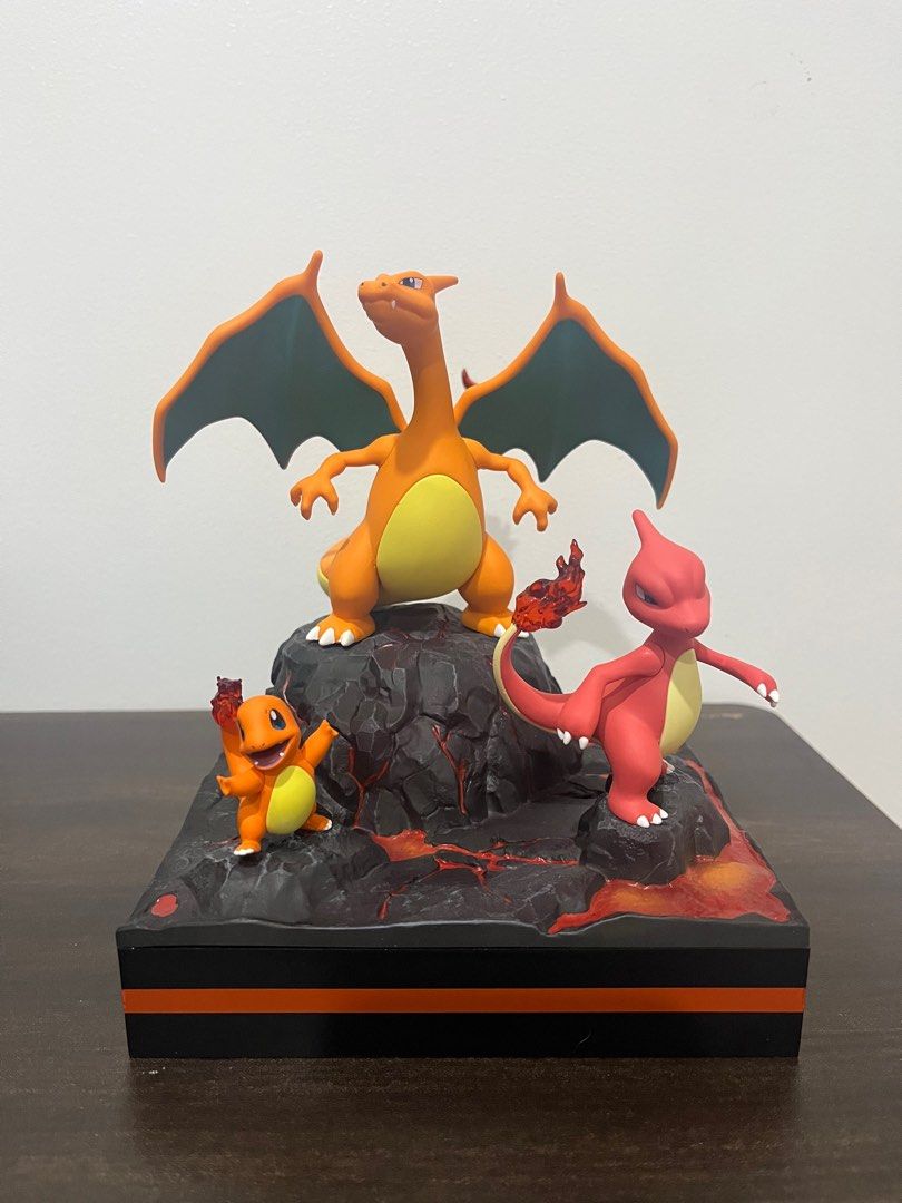 Pokemon Charizard Evolution Figurine (Category: Figurines & Statues) located in Manila. Submitted by mixtibles (Listing ID 1408238553, Image 3). Description: - Features the complete Charizard evolution line: Charmander, Charmeleon, and Charizard. - Displayed on a unique lava-themed base. - Includes original box. - A must-have collectible for Pokemon enthusiasts. - Not authentic but quality. .