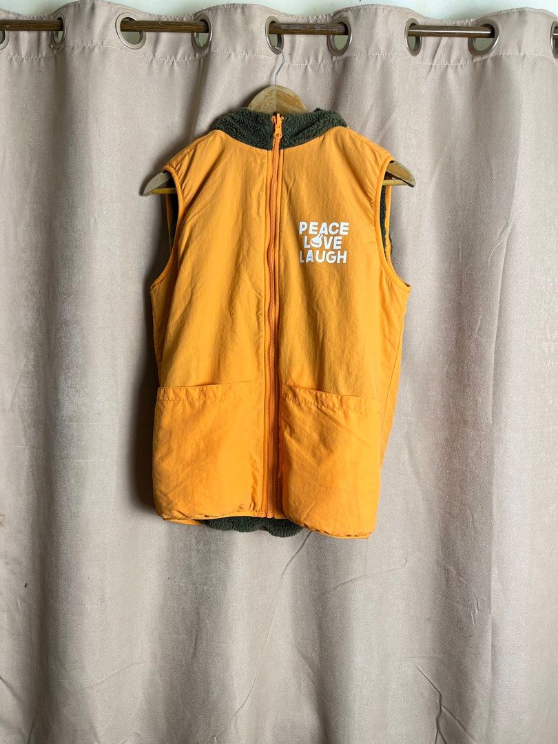 RAH! Reversible Vest (Category: Vests) located in Cebu City. Submitted by klvnthrifts (Listing ID 1408146143, Image 3). Description: - RAH! Reversible Vest - Exterior: Green fleece with orange pocket and trim, "Say It Loud" patch - Interior: Yellow with "Peace Love Laugh" print - Features: Hood, zipper closure - Size: M / 160/80A.