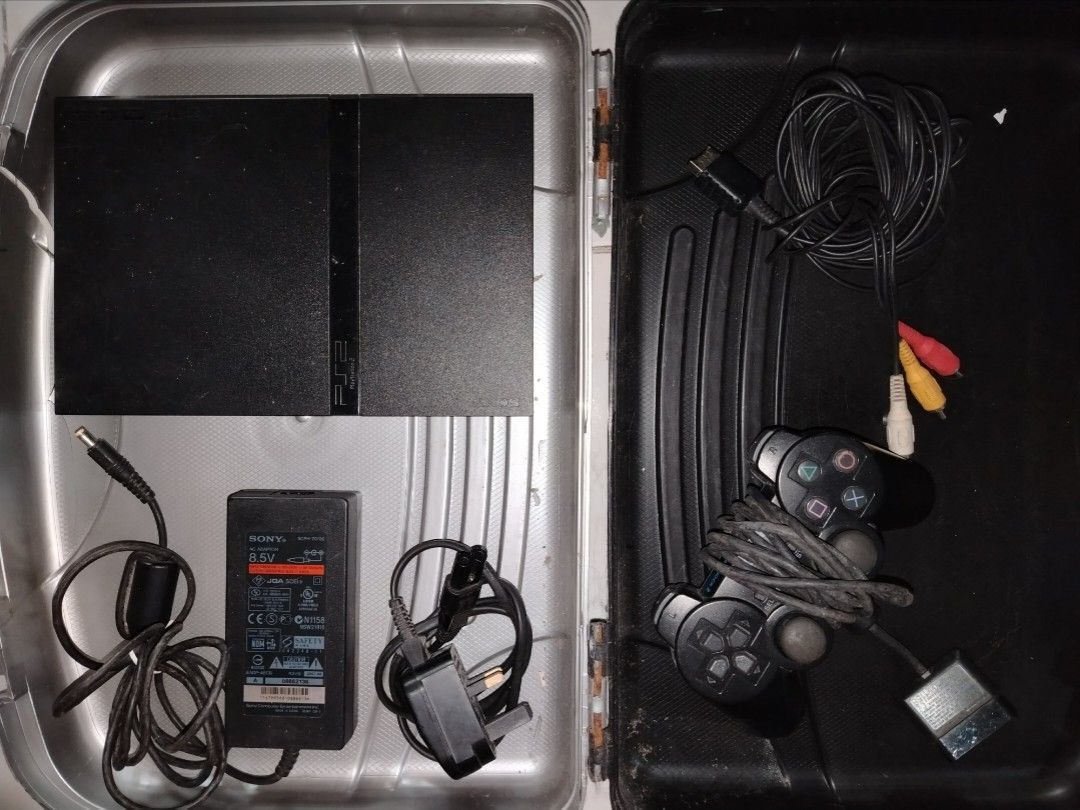 Sony PlayStation 2 Console (Category: PlayStation) located in Manila. Submitted by royalwater_4020c8 (Listing ID 1408117402, Image 1). Description: - Sony PlayStation 2 Slim console (black) - one controller - Power adapter included - AV cables with yellow, white, and red connectors - Console is in a case - Used only as DVD player shipping: LBC COP.