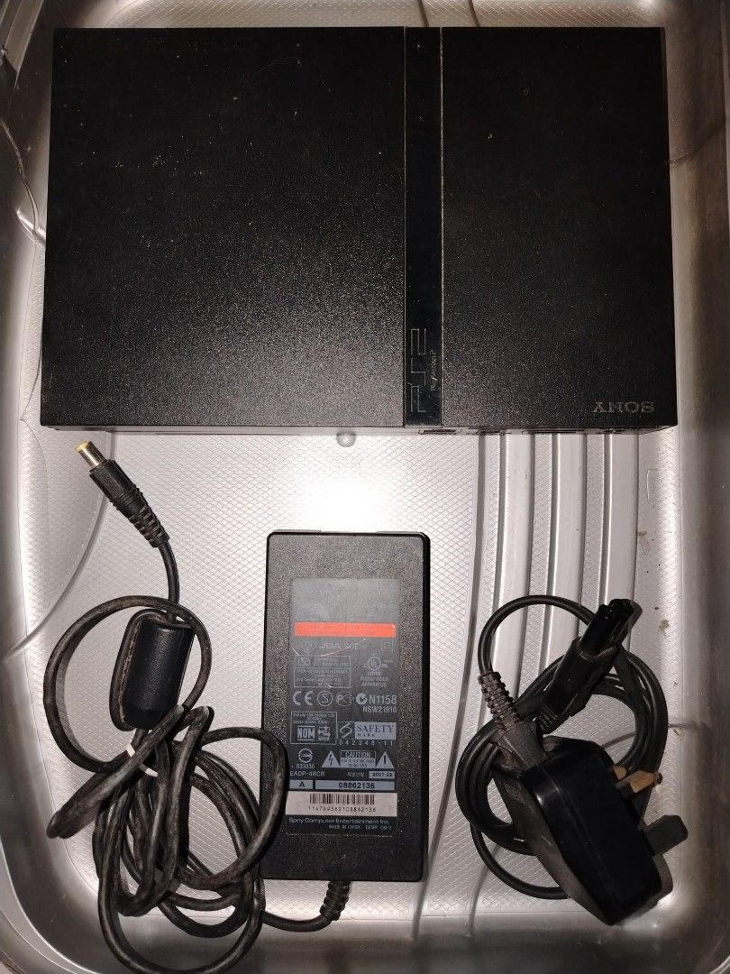 Sony PlayStation 2 Console (Category: PlayStation) located in Manila. Submitted by royalwater_4020c8 (Listing ID 1408117402, Image 2). Description: - Sony PlayStation 2 Slim console (black) - one controller - Power adapter included - AV cables with yellow, white, and red connectors - Console is in a case - Used only as DVD player shipping: LBC COP.