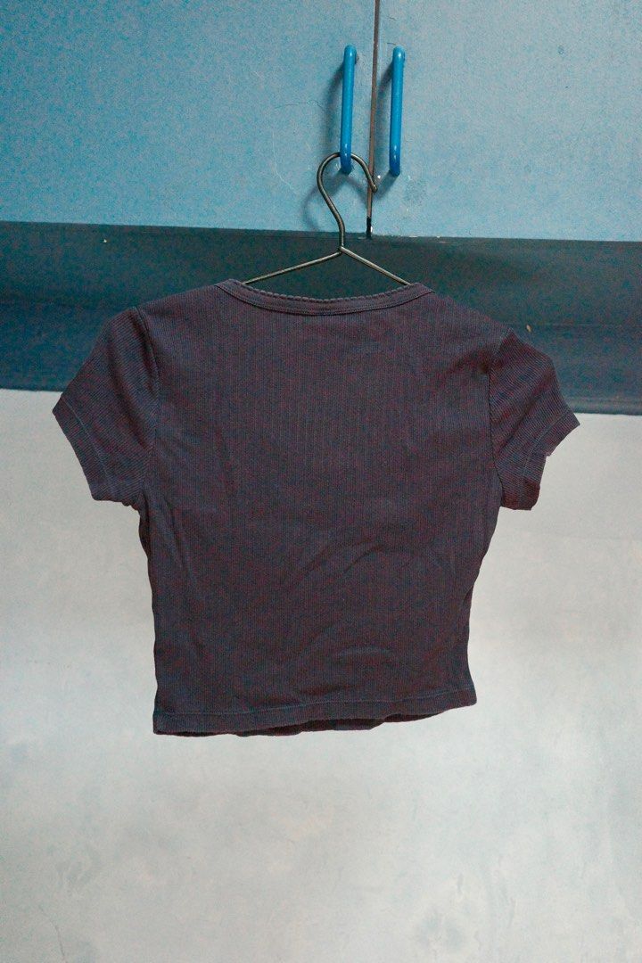 Uniqlo Ribbed Crop Top - Size S (Category: Shirts) located in Quezon City. Submitted by kitkat0328 (Listing ID 1408182461, Image 3). Description: - Uniqlo Ribbed Crop Top - Color: Navy blue - Features: Scoop neckline, button-up front - Sleeves: Short - Fit: Fitted, cropped silhouette - Size: S - Made in Vietnam.