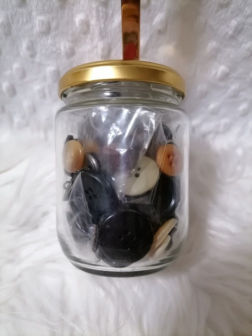 Vintage Button Collection in Jar (Category: Craft Supplies & Tools) located in Butuan. Submitted by az-branded.items (Listing ID 1408295441, Image 1). Description: Collection of various vintage buttons in different sizes, shapes, and colors. Includes buttons in a jar with a decorative lid. Some buttons are still in their original packaging. The collection includes black, white, beige, and brown buttons. Perfect for sewing, crafts, or collecting..