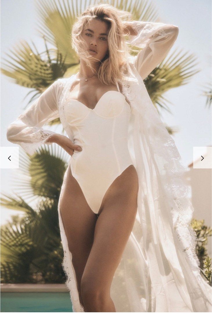 White Bodysuit with Robes Lace (Category: Undergarments & Loungewear) located in Subic. Submitted by belaeilish (Listing ID 1408165283, Image 1). Description: - White bodysuit with sweetheart neckline - Adjustable straps - Smooth, satin-like finish - Includes sheer, long lace robe - Intricate floral detailing on robe - Wide sleeves and delicate lace trim on robe - Ideal for special occasions.