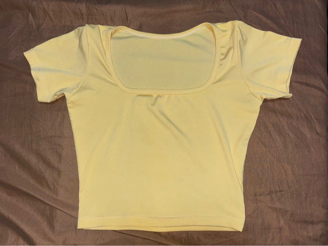 Yellow Ribbed Square Neck Crop Top (Category: Shirts) located in Angono. Submitted by kalidope (Listing ID 1408249264, Image 2). Description: - Yellow crop top - Square neckline - Ribbed fabric - Short sleeves - Fitted silhouette - Lightweight material - Versatile design.