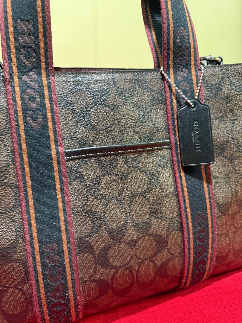 🏷️ AUTHENTIC COACH SMITH TOTE BAG (Category: Luxury Bags & Wallets) located in Paranaque City. Submitted by jesulz (Listing ID 1408402745, Image 2). Description: Measurements Length: 13.5” Height: 10.0” Width: 5.0” Materials Signature canvas Handle Handles with 5” drop Strap Detachable strap with 22.5” drop for shoulder or crossbody wear Features Outside open pocket Inside zip and multifunction pockets.