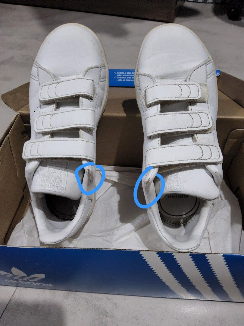 Adidas Stan Smith CF C FX7535 US 13.5 (Category: Babies & Kids Fashion) located in Taytay. Submitted by chi.locker (Listing ID 1408313981, Image 3). Description: Adidas Stan Smith CF C shoes in white. Features three velcro straps for closure. The size is 13.5 US. The shoes have some wear and tear, as shown in the images..