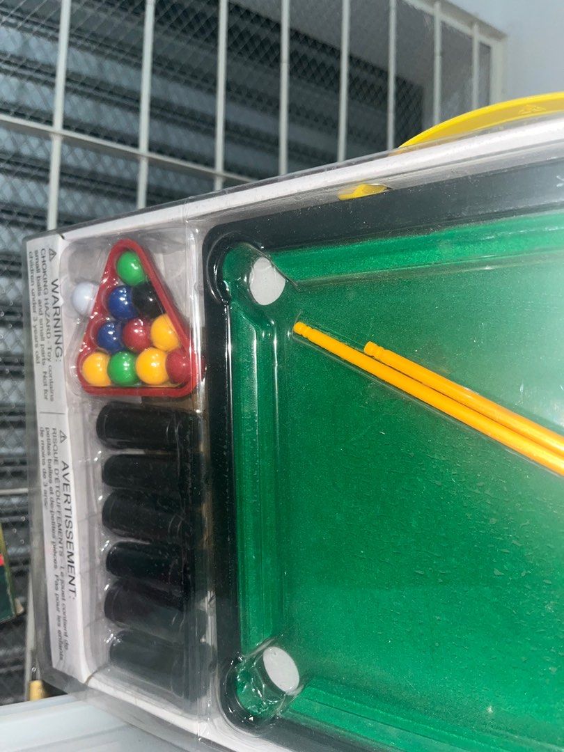 Billiards Toy Game (Category: Kids Toys) located in Manila. Submitted by krnnyx (Listing ID 1408449109, Image 1). Description: - Fun billiards game for kids! - Includes a mini green billiards table. - Comes with colorful billiard balls. - Features a triangle rack for ball setup. - Includes two yellow cues. - Suitable for ages 3 and up. - Packaged in a clear plastic box..