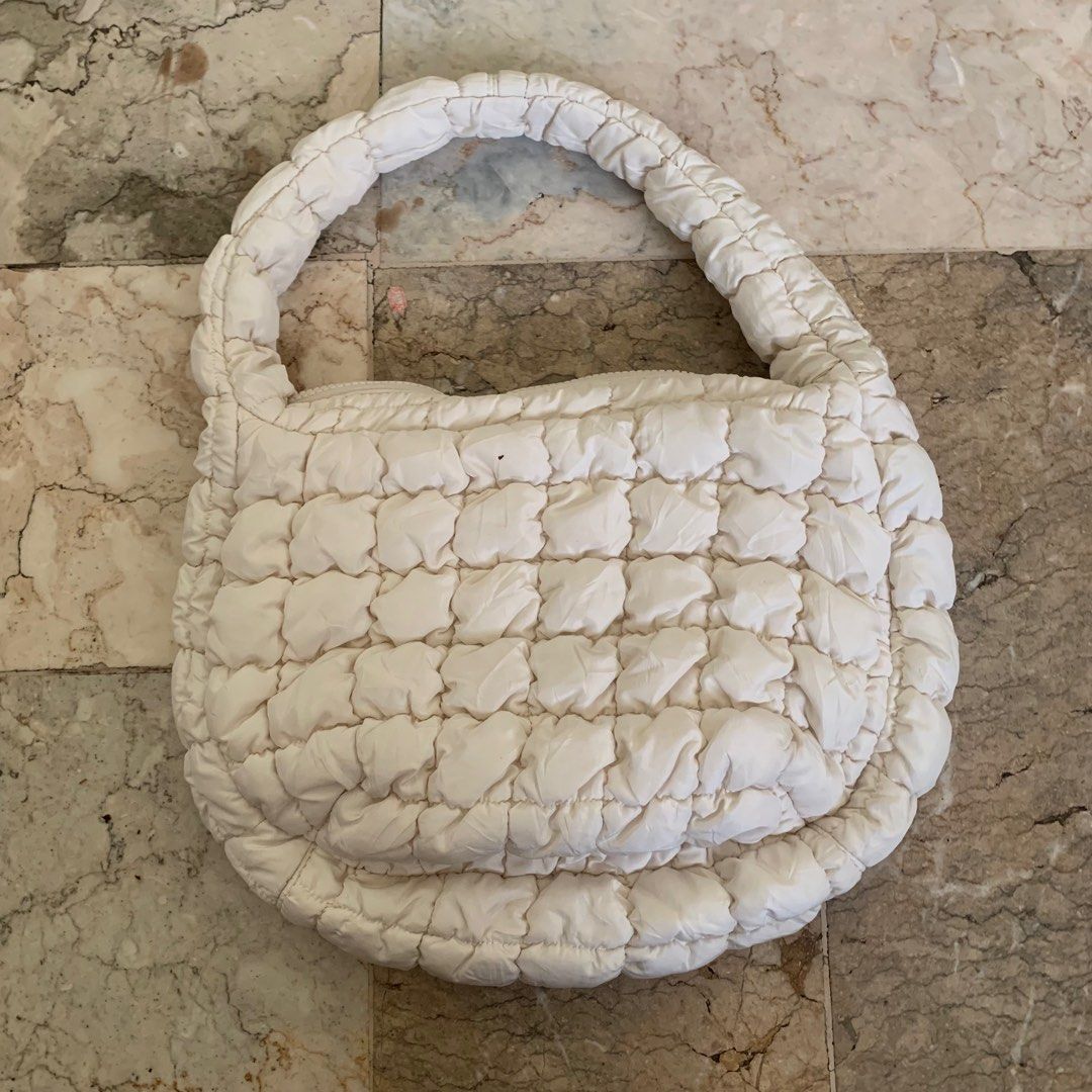 COS Mini Quilted Handbag / cloud bag/ puffer bag (Category: Luxury Bags & Wallets) located in Tarlac. Submitted by closetcleanupsale.ph (Listing ID 1408372860, Image 2). Description: Authentic COS Quilted Handbag Elegant off white design Soft, padded material Top handle for easy carrying Secure zip closure Spacious interior for your essentials No stains, no rips used few times then stored nicer in actual when the bag is already full LP POSTED.