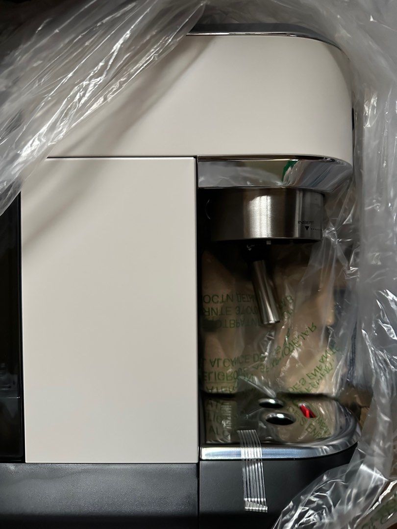 DeLonghi Dedica Style Espresso Coffee Maker (Category: Coffee Machines & Makers) located in Manila. Submitted by konami_bjork (Listing ID 1408456406, Image 2). Description: Brand New DeLonghi Dedica Style espresso and cappuccino coffee maker. Includes a descaler for coffee machines. Comes with accessories and manuals. Features a milk frothing wand for creating cappuccinos. The machine is white and silver in color. Includes the original box and pa