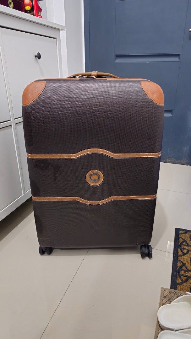 Delsey Chatelet Large Luggage Suitcase (Category: Luggage) located in Rizal. Submitted by dailyfindsphl (Listing ID 1408390195, Image 2). Description: Delsey Chatelet Large Good as new Used twice Dimensions : H 77 x L 53.5 x D 32.5cm Capacity : 112L Weight : 5.1kg - Delsey luggage suitcase - Brown and tan accents - Multiple interior compartments with zippered closures - Wheels for easy transport - Carrying handle - Textured exterior finish - Redd