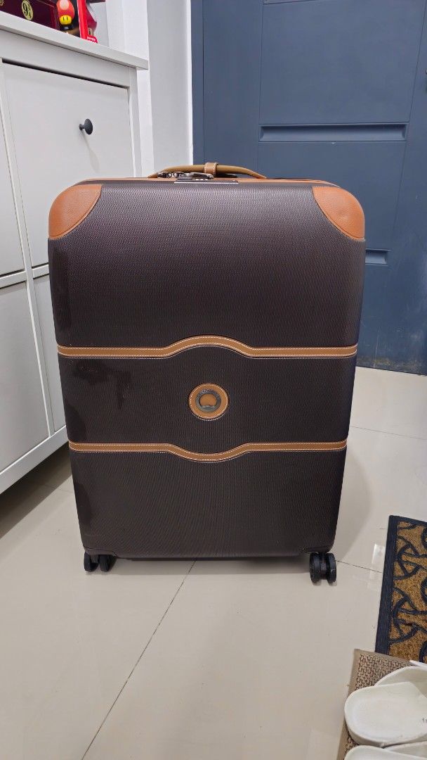 Delsey Chatelet Large Luggage Suitcase (Category: Luggage) located in Rizal. Submitted by dailyfindsphl (Listing ID 1408390195, Image 1). Description: Delsey Chatelet Large Good as new Used twice Dimensions : H 77 x L 53.5 x D 32.5cm Capacity : 112L Weight : 5.1kg - Delsey luggage suitcase - Brown and tan accents - Multiple interior compartments with zippered closures - Wheels for easy transport - Carrying handle - Textured exterior finish - Redd