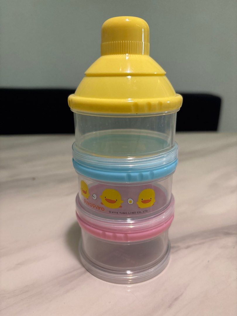 Formula Dispenser - Stackable (Category: Breastfeeding & Bottle Feeding) located in Singapore. Submitted by mickey_dots (Listing ID 1408316439, Image 1). Description: - Stackable formula dispenser for easy on-the-go feeding. - Multiple compartments for pre-measured formula. - Easy to clean and compact for travel. - Adorable design with piyo graphics..