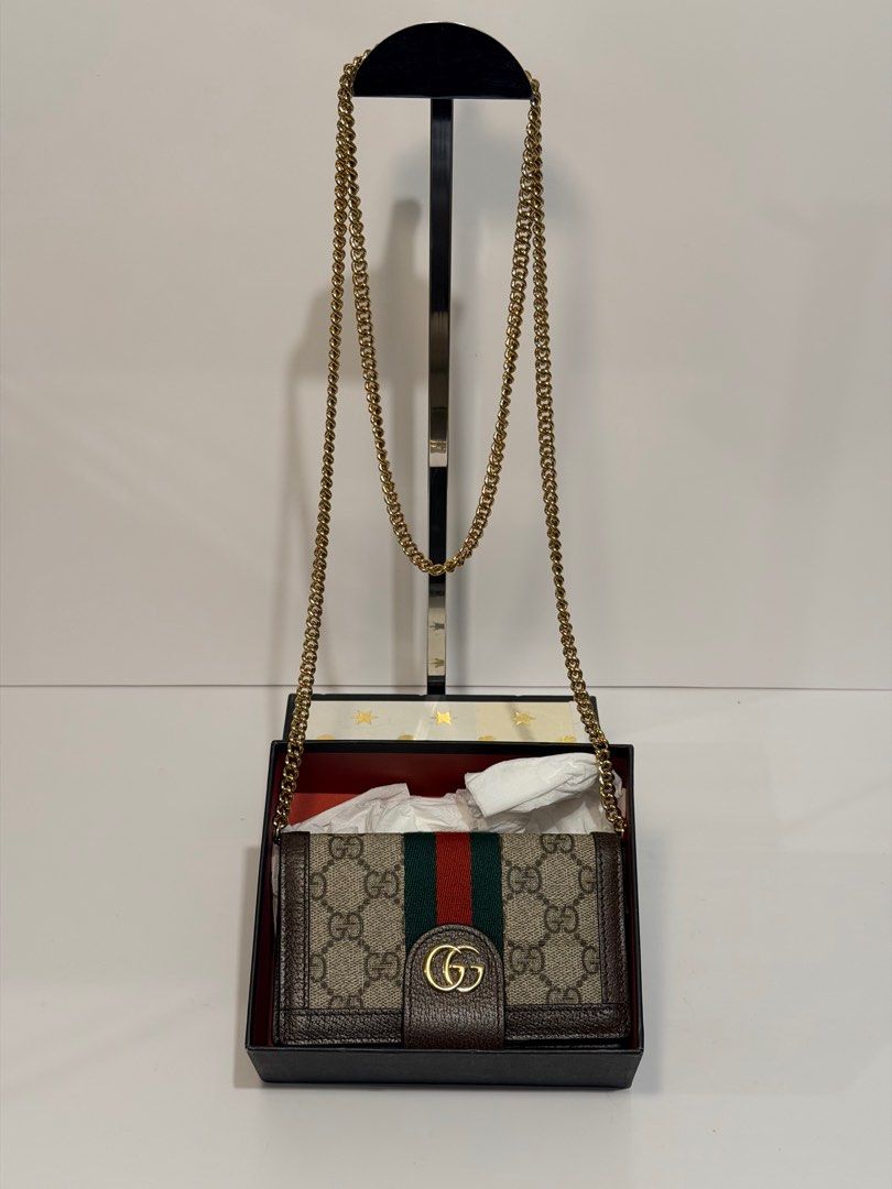 Gucci GG Marmont Wallet on Chain (Category: Luxury Bags & Wallets) located in Olongapo. Submitted by howietv (Listing ID 1408379229, Image 1). Description: - Gucci GG Marmont Wallet on Chain - Iconic GG logo and signature green/red stripe - Includes chain strap - Comes with original box - Multiple card slots and compartments - Crafted from high-quality materials - Classic Gucci design.