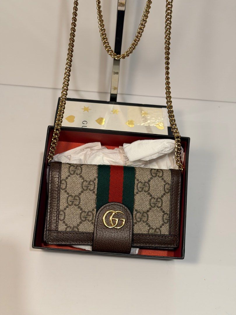 Gucci GG Marmont Wallet on Chain (Category: Luxury Bags & Wallets) located in Olongapo. Submitted by howietv (Listing ID 1408379229, Image 2). Description: - Gucci GG Marmont Wallet on Chain - Iconic GG logo and signature green/red stripe - Includes chain strap - Comes with original box - Multiple card slots and compartments - Crafted from high-quality materials - Classic Gucci design.