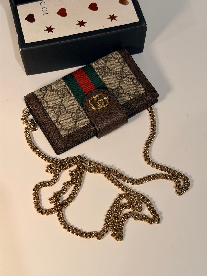 Gucci GG Marmont Wallet on Chain (Category: Luxury Bags & Wallets) located in Olongapo. Submitted by howietv (Listing ID 1408379229, Image 3). Description: - Gucci GG Marmont Wallet on Chain - Iconic GG logo and signature green/red stripe - Includes chain strap - Comes with original box - Multiple card slots and compartments - Crafted from high-quality materials - Classic Gucci design.