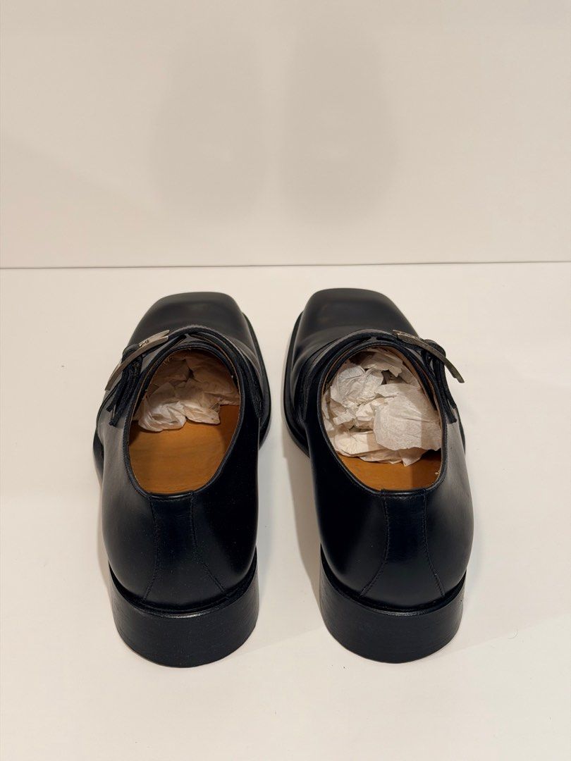 Hermes Black Leather Monk Strap Shoes (Category: Dress Shoes) located in Olongapo. Submitted by howietv (Listing ID 1408380058, Image 3). Description: - Authentic Hermes monk strap shoes - Black leather - Square toe design - Silver buckle closure - Hermes logo on insole and sole - Size 40B - Made in Italy - Includes dust bags.