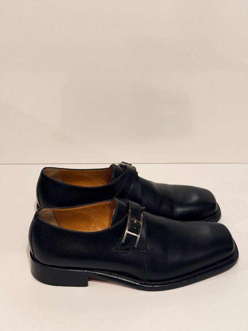 Hermes Black Leather Monk Strap Shoes (Category: Dress Shoes) located in Olongapo. Submitted by howietv (Listing ID 1408380058, Image 2). Description: - Authentic Hermes monk strap shoes - Black leather - Square toe design - Silver buckle closure - Hermes logo on insole and sole - Size 40B - Made in Italy - Includes dust bags.