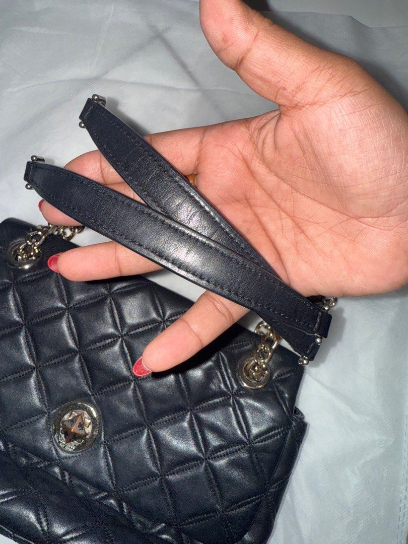 Kate Spade Black Quilted Shoulder Bag (Category: Luxury Bags & Wallets) located in Manila. Submitted by boldshark-6592 (Listing ID 1408398175, Image 2). Description: - Kate Spade shoulder bag - Black quilted design - Chain strap with leather accents - Flap closure with decorative clasp - Leather material - Diamond pattern.