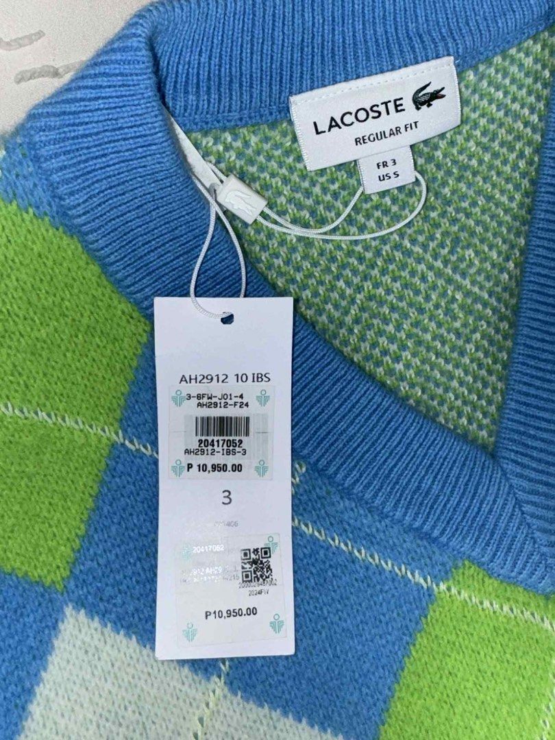 Lacoste Argyle Sweater Vest (Category: Vests) located in Manila. Submitted by blossom.mystique21 (Listing ID 1408408738, Image 3). Description: - Authentic Lacoste sweater vest - Argyle pattern - V-neck design - Size 3 (US S) - Features Lacoste crocodile logo - Brand new with original tags - Includes Lacoste shopping bag - Color scheme: Blue, green, and white.