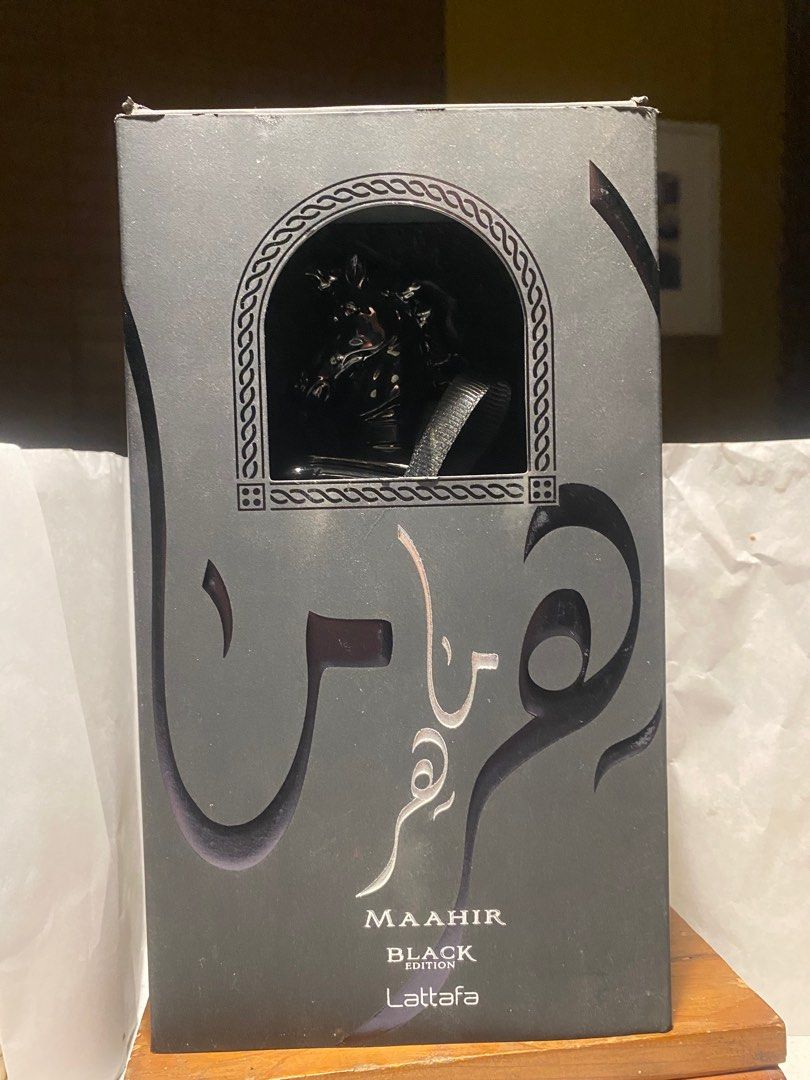 Lattafa Maahir Black Edition Eau de Parfum (Category: Fragrance & Deodorants) located in Plaridel. Submitted by marcgaba (Listing ID 1408490937, Image 1). Description: Lattafa Maahir Black Edition Eau de parfum, 100ml, see pic for level Paint near atomizer was low quality and it bubbled, so I peeled some off. Does not affect juice. Uber masculine, dark and smoky See pic for level PRICE: 1800 MOP: BPI / GCASH SHIPPING: J&T from Plaridel, Bulacan N
