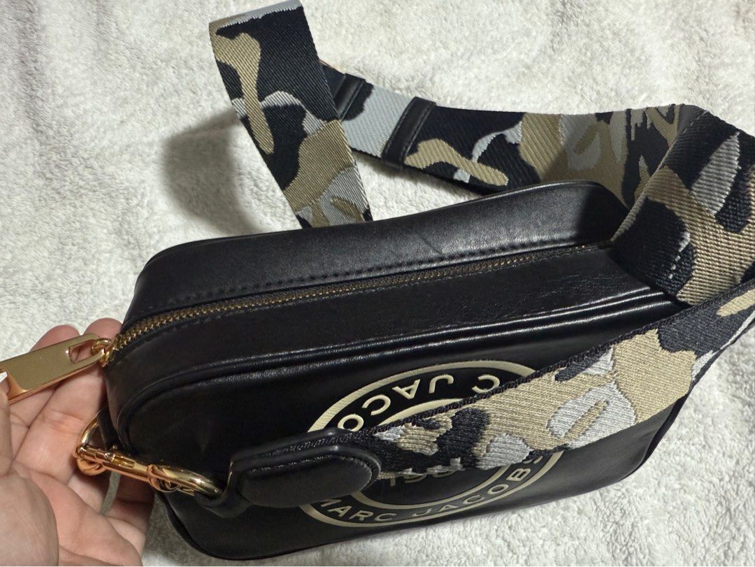 Marc Jacobs The Box Crossbody Bag (Category: Luxury Bags & Wallets) located in San Juan City. Submitted by rizalaine01 (Listing ID 1408465327, Image 3). Description: - Marc Jacobs crossbody bag - Black color - Features a circular logo - Camouflage strap - Zip closure - Gold-tone hardware - Adjustable strap - Made of leather.