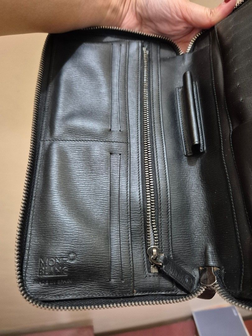 Montblanc Black Leather Zip Around Wallet (Category: Luxury Bags & Wallets) located in Pasig City. Submitted by 53888 (Listing ID 1408477469, Image 3). Description: - Authentic Montblanc wallet coded - Black leather zip-around design - Multiple card slots - Zippered compartment for coins or small items - Bill compartment - Silver-toned zipper and hardware - Montblanc logo visible inside and out - Made with high-quality leather .