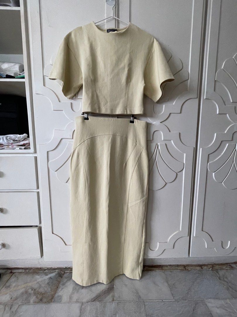 Pre-loved Set#2 ZARA Two-Piece Skirt Set (Category: Sets or Coordinates) located in Makati City. Submitted by ccprelovedclothes (Listing ID 1408348410, Image 1). Description: - Zara butter yellow two-piece set - Includes crop top (size M) and high-waisted midi skirt (size L) - Made in Bangladesh - Features a minimalist design - Versatile for various occasions.