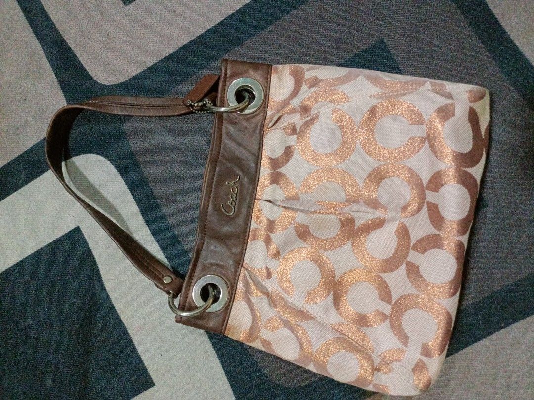 Vintage CoAch Bag (Category: Luxury Bags & Wallets) located in Quezon City. Submitted by elysian.manila (Listing ID 1408427876, Image 1). Description: Buy and Sell of coach, one of my pre loved not so used with me. with minor scratch but still leather intact. Not rusty in steels. smells vintage! Need wash (no to maarte, alam naman na vintage na ehhhh) shipping included! can do meet up QC..