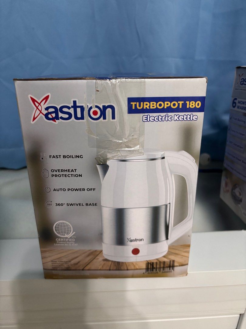 Xastron Turbopot 180 Electric Kettle (Category: Kettles & Airpots) located in Pila. Submitted by eliphalez (Listing ID 1408495704, Image 1). Description: Xastron Turbopot 180 electric kettle. Features fast boiling, overheat protection, auto power off, and a 360° swivel base. The kettle has a white body with a silver band and a red power indicator. It is certified and comes in its original packaging..