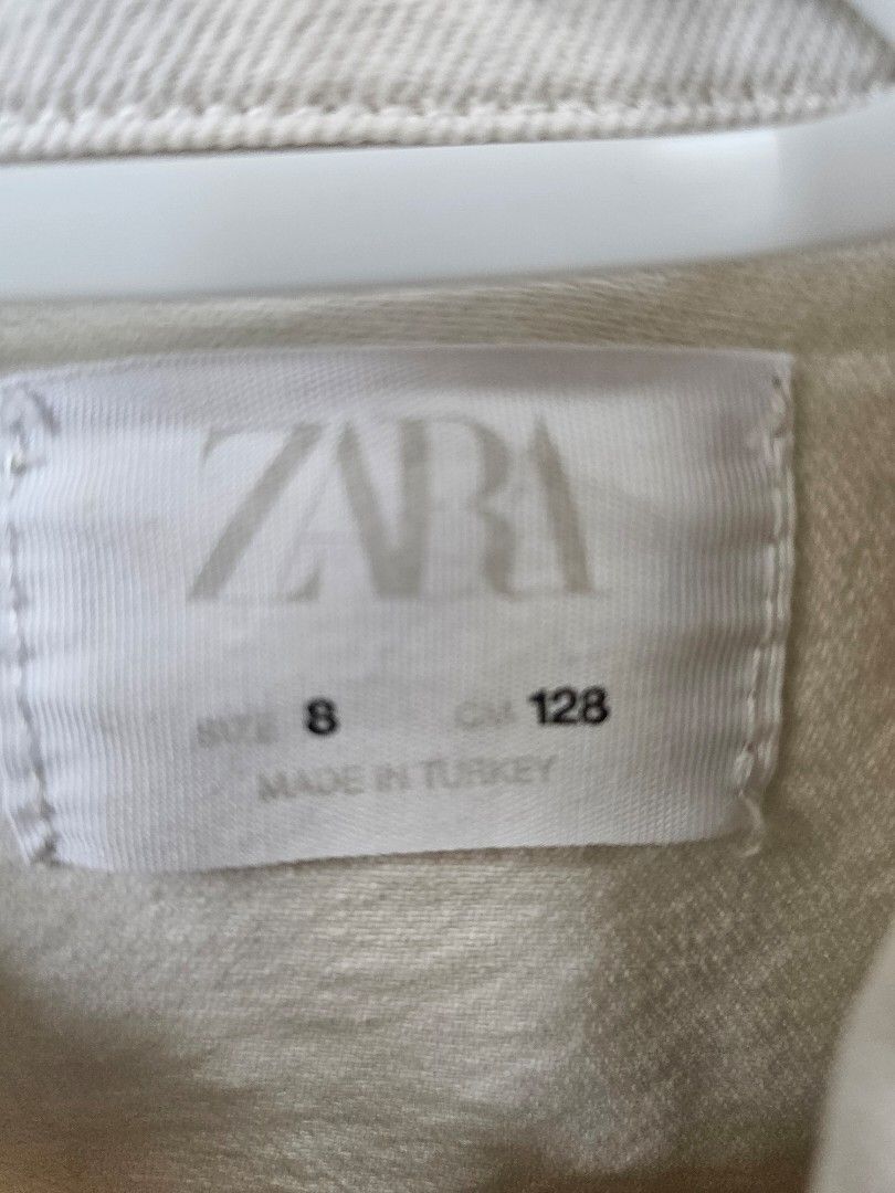 Zara Embroidered Denim Jacket - Size 8 (Category: Coats, Jackets and Outerwear) located in Mandaluyong City. Submitted by blueberrypatch (Listing ID 1408343371, Image 2). Description: - Zara denim jacket for girls - Size 8 (128cm) - Cream color - Embroidered with red flower details - Two front pockets - Button closures - Made in Turkey.