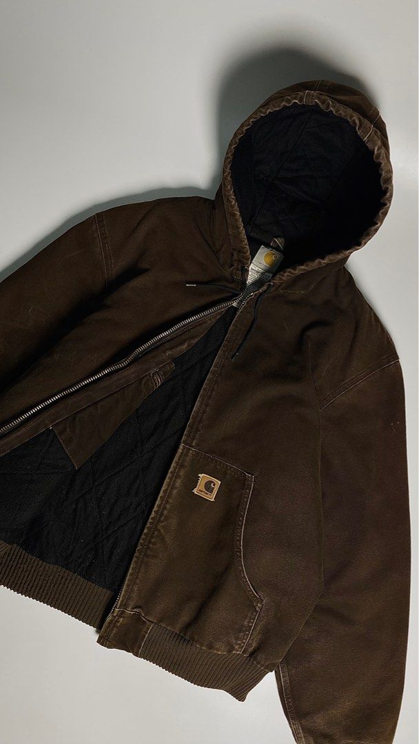 05’s Vintage Carhartt Choco Brown Active Jacket (Category: Coats, Jackets and Outerwear) located in Antipolo. Submitted by 1870thrift.wm (Listing ID 1408633206, Image 2). Description: 05’s Vintage Carhartt Choco Brown Active Duck Jacket Tag Size - (J130 DKB |L 28” width 28” length Durable Carhartt hooded jacket in brown. Features a full zip closure, two front pockets, and a ribbed hem and cuffs. The interior lining is black and quilted. Includes 