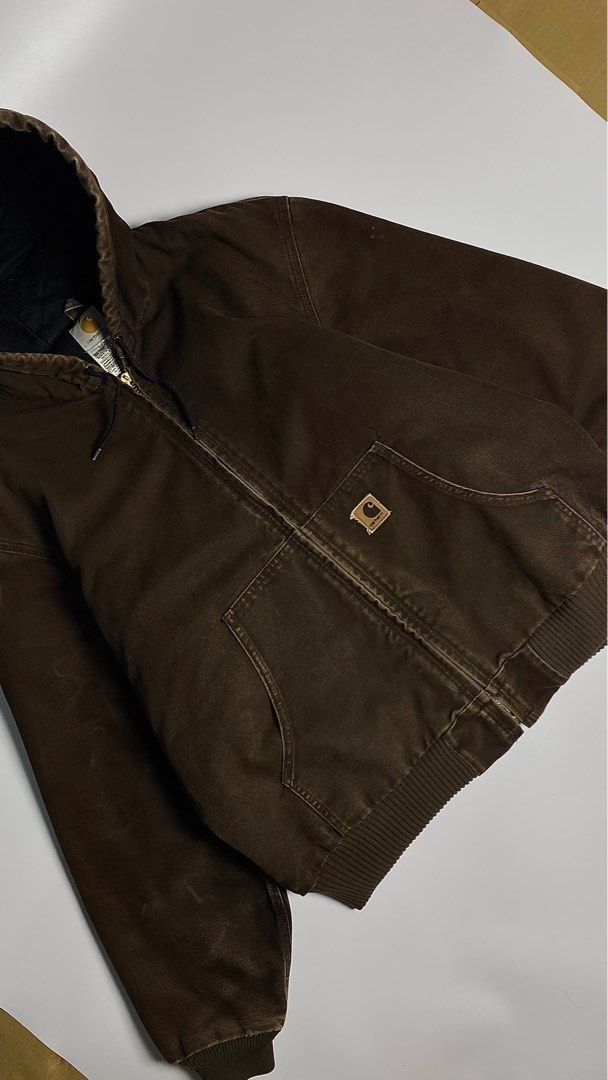 05’s Vintage Carhartt Choco Brown Active Jacket (Category: Coats, Jackets and Outerwear) located in Antipolo. Submitted by 1870thrift.wm (Listing ID 1408633206, Image 3). Description: 05’s Vintage Carhartt Choco Brown Active Duck Jacket Tag Size - (J130 DKB |L 28” width 28” length Durable Carhartt hooded jacket in brown. Features a full zip closure, two front pockets, and a ribbed hem and cuffs. The interior lining is black and quilted. Includes 