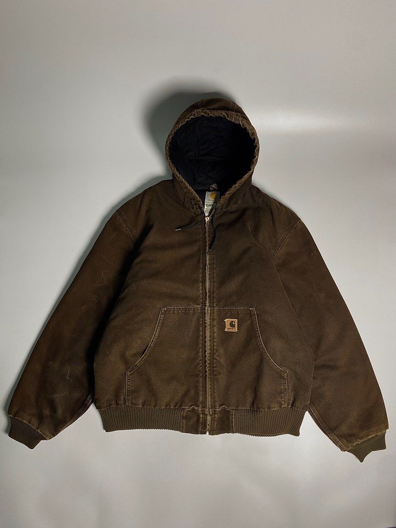 05’s Vintage Carhartt Choco Brown Active Jacket (Category: Coats, Jackets and Outerwear) located in Antipolo. Submitted by 1870thrift.wm (Listing ID 1408633206, Image 1). Description: 05’s Vintage Carhartt Choco Brown Active Duck Jacket Tag Size - (J130 DKB |L 28” width 28” length Durable Carhartt hooded jacket in brown. Features a full zip closure, two front pockets, and a ribbed hem and cuffs. The interior lining is black and quilted. Includes 