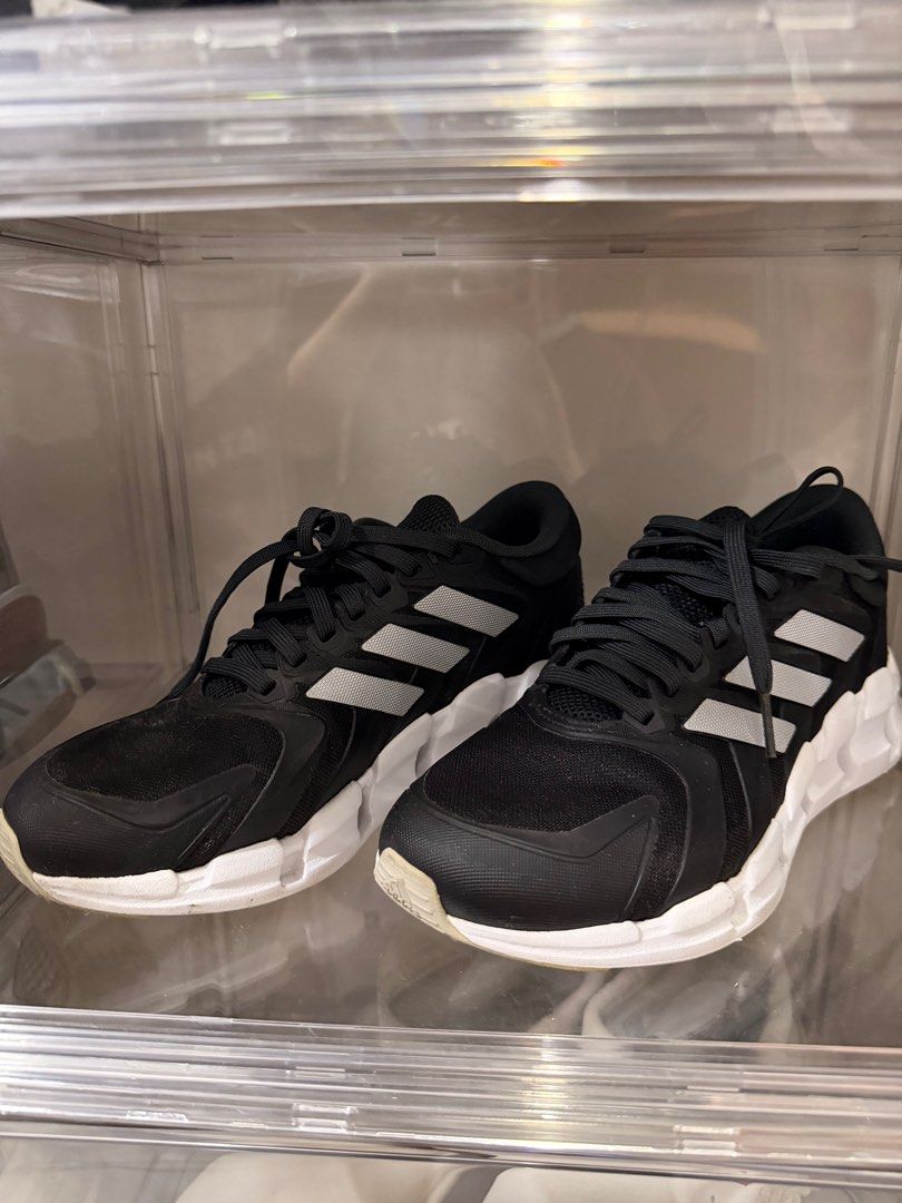 Adidas Black Sneakers (Category: Sneakers) located in Manila. Submitted by troddetrading (Listing ID 1408658067, Image 1). Description: - Black Adidas sneakers - White soles and silver stripes - Mesh upper - Lace-up closure - Shows wear on soles - Includes clear plastic container.
