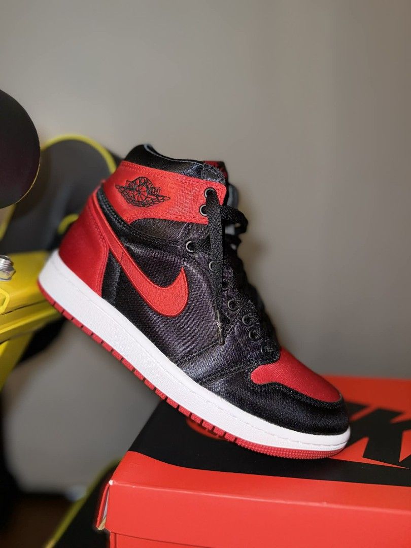AIR JORDAN 1 SATIN BRED (Category: Sneakers) located in Pasay City. Submitted by atoaph (Listing ID 1408687248, Image 2). Description: AIR JORDAN 1 SATIN BRED WMNS - 6US (23cm) ✅ ORIGINAL ✅ JAPAN RELEASE ✅ BOX FRESH Air Jordan 1 "Satin Bred" high-top sneakers The iconic Air Jordan 1 sneakers are sculpted to a basketball-inspired high-top silhouette. This pair is crafted from black leather and refreshed with red satin overlays. A rubber sole adds 