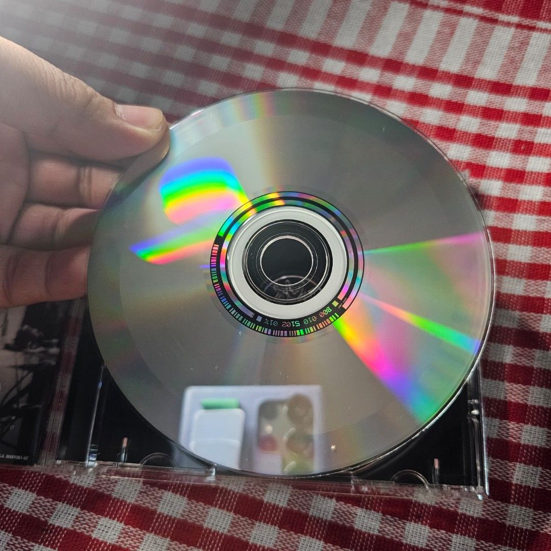 Andrew W.K. - The Wolf CD - CD Mint (Category: CDs & DVDs) located in Quezon City. Submitted by serefrenpaz (Listing ID 1408591828, Image 3). Description: CD features Andrew W.K.'s album "The Wolf." The CD case includes the album art and tracklist. The disc itself is visible, along with the booklet containing lyrics and additional images. The album includes tracks such as "Victory Strikes Again," "Long Live the Party," and "I Love Music.".