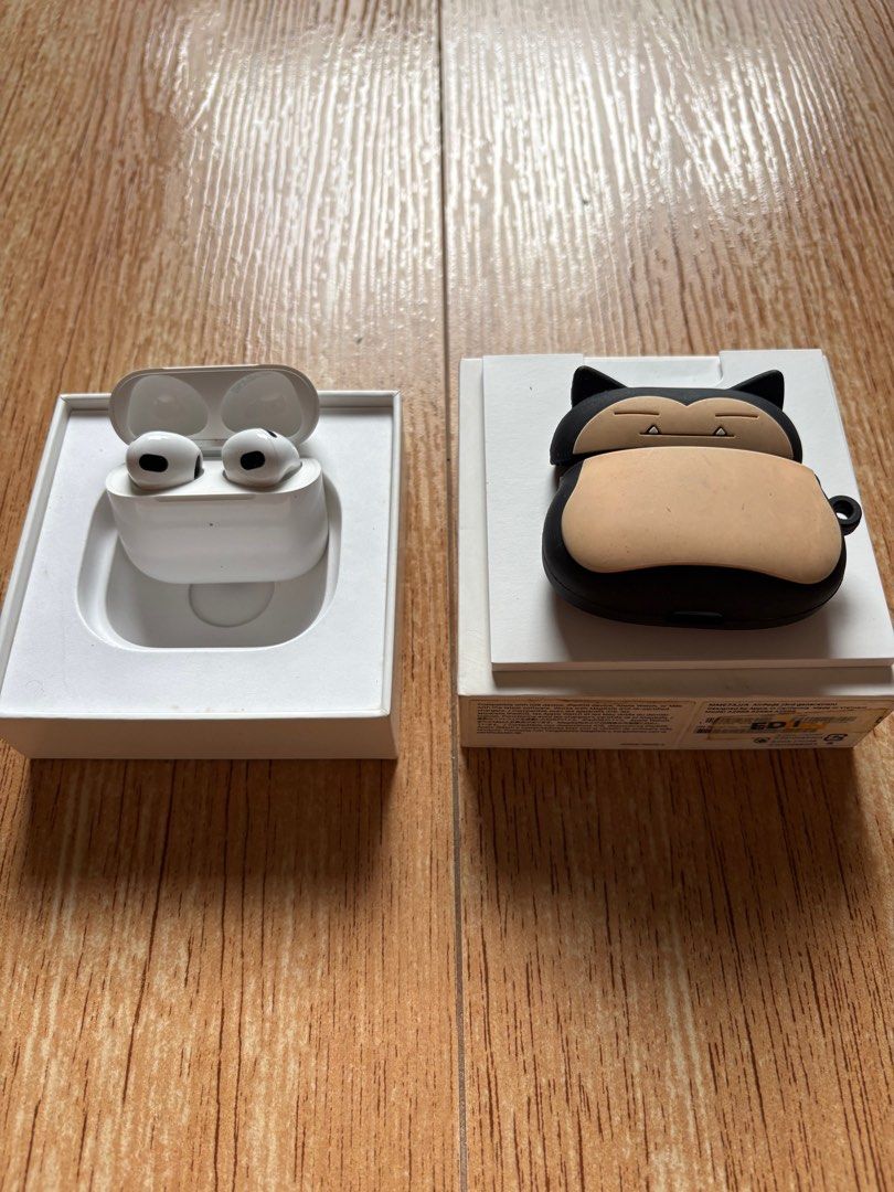 Apple AirPods 3rd Generation with box (Category: Earphones) located in Manila. Submitted by loislane112233 (Listing ID 1408567750, Image 1). Description: - Apple AirPods 3rd Generation - Includes charging case - Comes with original box and documentation - Includes a Snorlax case - AirPods and charging case color: White - Snorlax case color: Black and Beige.
