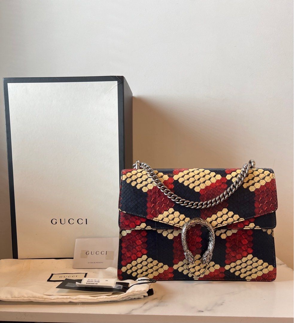 Authentic Gucci Medium Dionysus Python (Category: Bags & Wallets) located in Kuala Lumpur. Submitted by christ79 (Listing ID 1408556962, Image 1). Description: Width : 12 inch Height : 8 inch Depth : 4 Inch Condition : Very Good Condition Comity with box , Dust bag and authentic card label.( as per photo) This is handcrafted in Python skin.(RARE) Only meet up or by Lalamove ( fees by buyer).