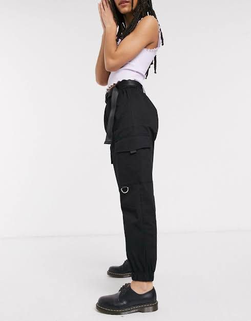 Bershka Black Jogger Cargo Pants (Category: Other Bottoms) located in Quezon City. Submitted by ryujin19 (Listing ID 1404384458, Image 1). Description: - Black cargo pants - Multiple pockets - Button and zipper closure - Straight leg design - Durable fabric - Classic and versatile style - No belt.