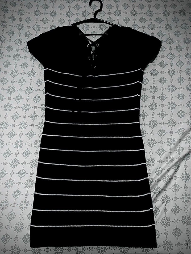Black and White Striped Dress (Category: Dresses) located in Manila. Submitted by leiluh (Listing ID 1408597792, Image 2). Description: - Classic black and white striped design - Flattering bodycon fit - Stylish v-neckline - Short sleeves - Lace-up back detail - Button detail on the front - Perfect for casual wear xs-m mod: jnt/lalamove mop: bpi/insta pay QR meetups: within vito cruz/españa/sampaloc/mnl area only +willing to nego : ).