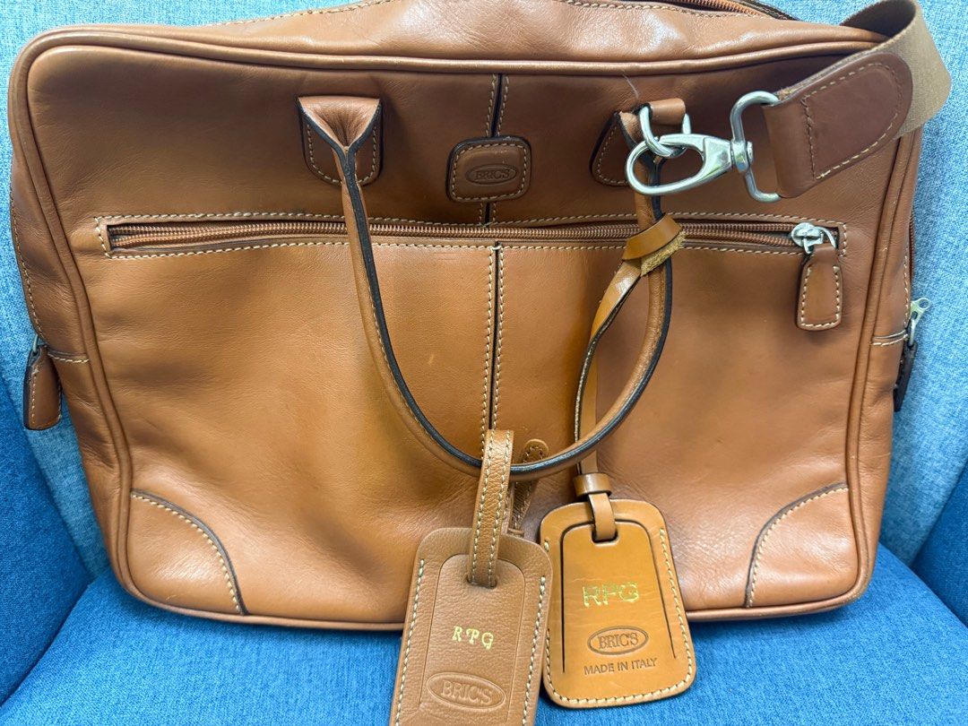 Bric's Leather Briefcase (Category: Luxury Bags & Wallets) located in Makati City. Submitted by luxuryshopper01 (Listing ID 1408625330, Image 2). Description: - Bric's genuine leather briefcase - Made in Italy - Front zippered pocket - Top handles - Detachable shoulder strap - Includes luggage tags - Multiple interior compartments - Interior zippered pocket.