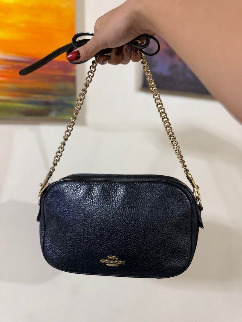 Coach Camera Bag Black (Category: Luxury Bags & Wallets) located in Quezon City. Submitted by vianca13 (Listing ID 1408523757, Image 1). Description: - Black Coach camera bag - Gold chain strap - Zip closure - Small Coach logo - Interior pocket - Coach label - Leather material - Gold-toned hardware - Detachable strap.