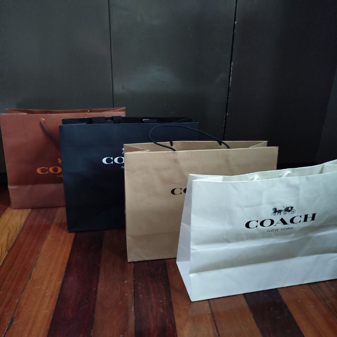 Coach paper bags (assorted styles) (Category: Luxury Bags & Wallets) located in Valenzuela. Submitted by cletini (Listing ID 1408513485, Image 1). Description: Price is per piece Coach 1: White - P100 (Sold) Coach 2: Kraft - P150 Coach 3: Black - P300 Coach 4: Bronze - P350 Condition Statement (Very Important): • Authentic: Guaranteed 100% original. • Swipe photos for paper bag size • The paper bag was used only once to transport the purchased it