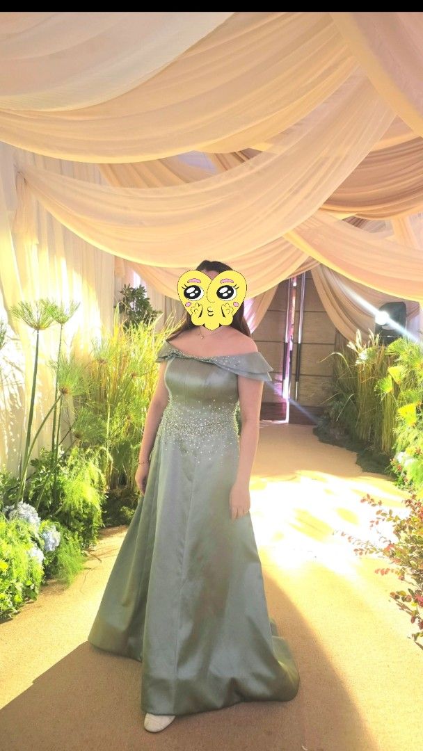 Elegant Sage Green Gown (Category: Evening dresses & gowns) located in Navotas City. Submitted by declutteringwithkc (Listing ID 1408629907, Image 1). Description: - Sage green off-shoulder gown: - Delicate beadwork on bodice - Flowing skirt - Ideal for formal events Rfs. Decluttering .