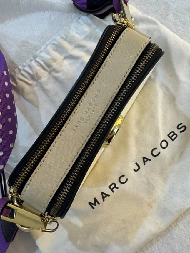 G. Authentic: Marc Jacobs The Snapshot Bag (Category: Luxury Bags & Wallets) located in Taguig. Submitted by c.preloveditems (Listing ID 1408577440, Image 3). Description: - Authentic Marc Jacobs The Snapshot Bag - Stylish white and purple color combination - Features a unique polka dot strap - Gold hardware - Perfect shoulder bag for any occasion.