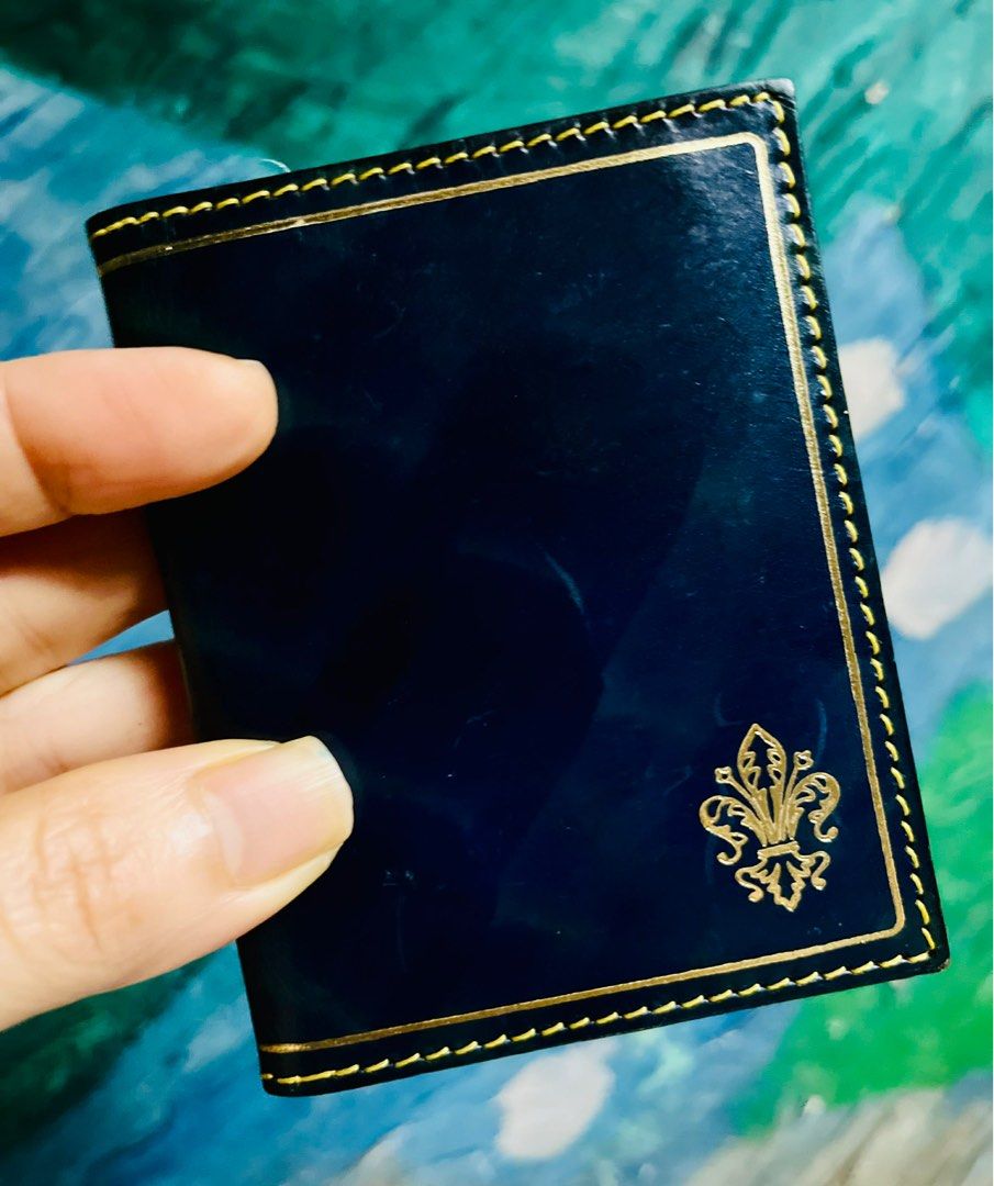 Genuine Leather Card Holder (Category: Wallets & Card holders) located in Antipolo. Submitted by MSelection (Listing ID 1408694705, Image 2). Description: - Genuine leather card holder - Navy blue exterior with gold accents - Features multiple card slots - Tan leather lining - Made in Florence - Decorative emblem.