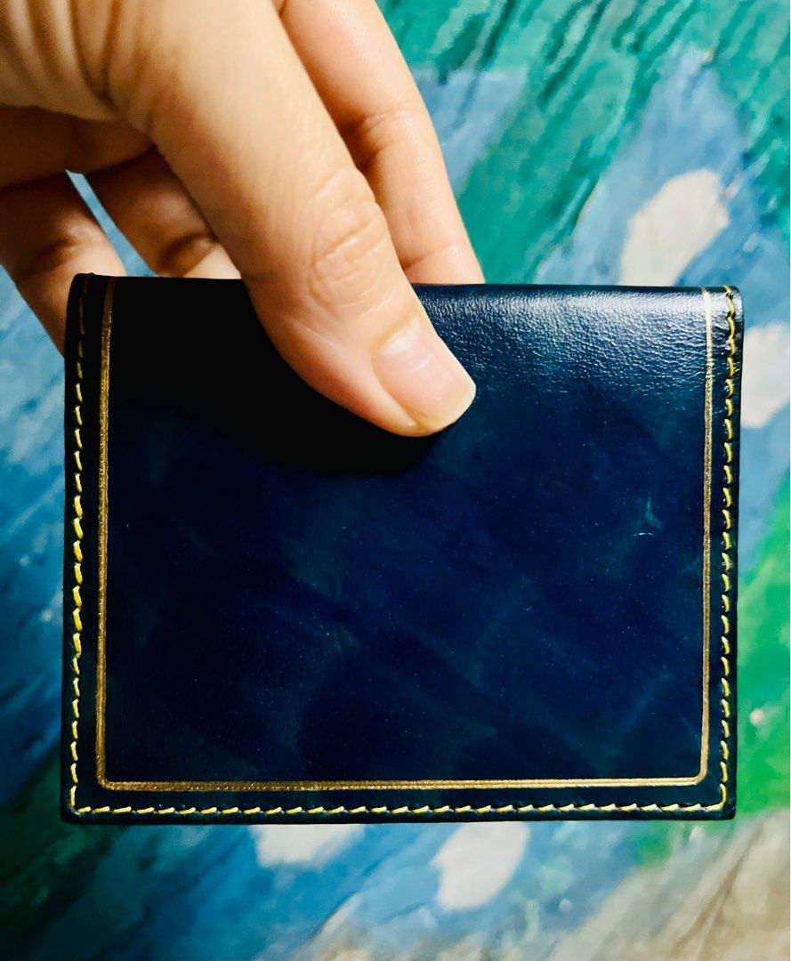 Genuine Leather Card Holder (Category: Wallets & Card holders) located in Antipolo. Submitted by MSelection (Listing ID 1408694705, Image 3). Description: - Genuine leather card holder - Navy blue exterior with gold accents - Features multiple card slots - Tan leather lining - Made in Florence - Decorative emblem.