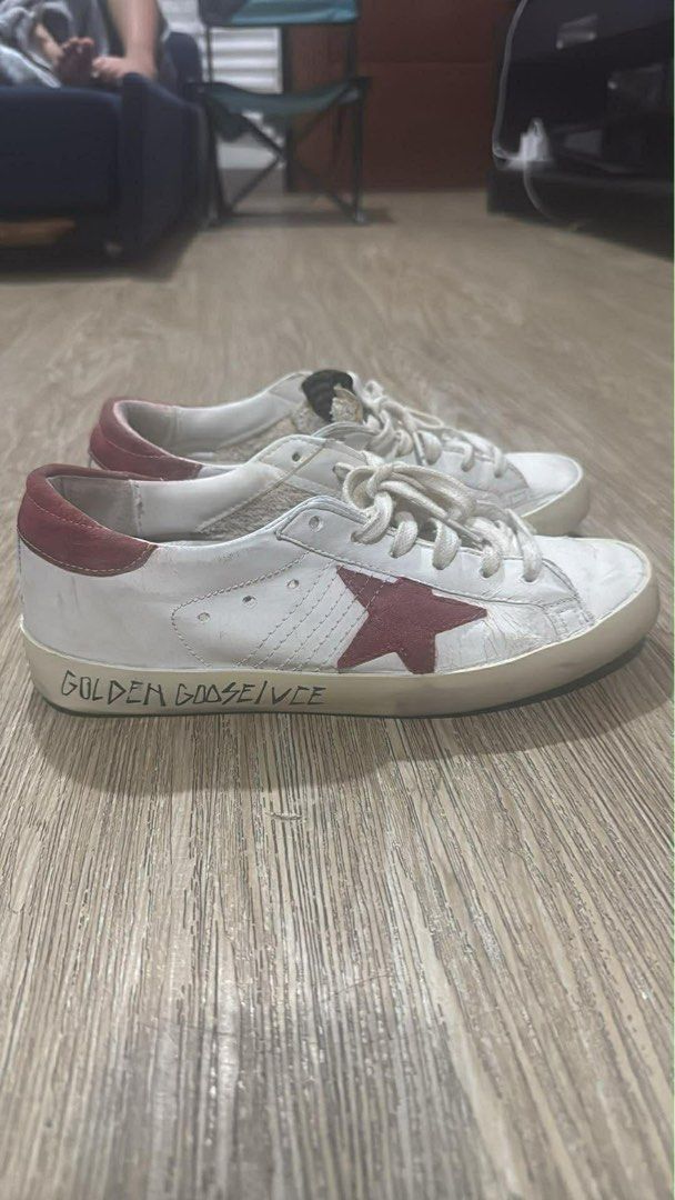 Golden Goose Super-Star Sneakers (Category: Sneakers) located in San Fernando. Submitted by akcd12 (Listing ID 1408598987, Image 1). Description: ✨ Golden Goose Superstar – White/Red Star (Restored Pair) ✨ Authentic Golden Goose Superstar sneakers in classic white with red star and heel tab. This pair has been professionally restored and refreshed — cleaned, treated, and detailed to bring back a neat, wearable condition while still keeping the si