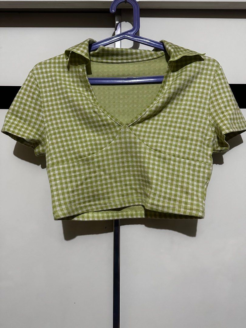 Green Gingham Crop Top (Category: Others Tops) located in Quezon City. Submitted by brookslide (Listing ID 1408630660, Image 1). Description: - Green and white gingham crop top - Collared neckline - Short sleeves - V-neck design - Lightweight fabric - Cropped style - Ideal for high-waisted bottoms.