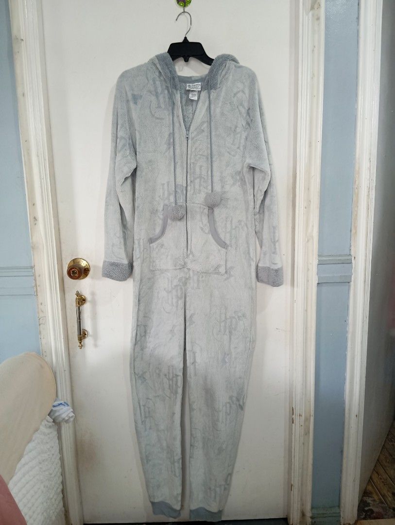 Harry Potter Hogwarts Onesie (Category: Coats, Jackets and Outerwear) located in Muntinlupa City. Submitted by challasy (Listing ID 1408536567, Image 2). Description: Barely Used Very Good Condition Original Harry Potter Wizarding World - Harry Potter onesie - Full zip closure - Hood with Harry Potter glasses and lightning bolt - Light blue color - Hogwarts logo print - Pockets - Pom-poms on front - Great for lounging or themed events Muntinlupa 